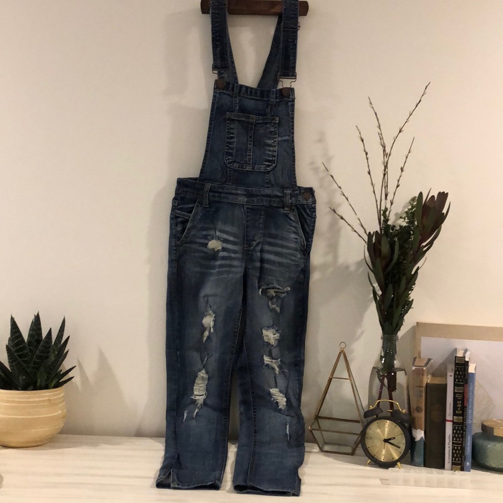 Distressed skinny overalls